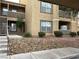 Well-maintained condo building with attractive landscaping and parking at 2300 E Silverado Ranch Blvd # 1072, Las Vegas, NV 89183