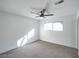 Bright bedroom featuring ceiling fan and grey carpet at 3123 Congress Ave, Las Vegas, NV 89121