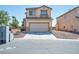 Two-story house with attached garage and desert landscaping, view from the street at 3548 Lonesome Drum St, North Las Vegas, NV 89032