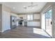 Spacious kitchen, featuring stainless steel appliances and white cabinets at 3548 Lonesome Drum St, North Las Vegas, NV 89032