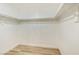 Spacious walk-in closet with wood-look flooring and ample shelf space at 3875 Redwood St, Las Vegas, NV 89103