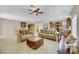 Bright and airy living room with tile flooring and ample seating at 6031 Lamotte Ave, Las Vegas, NV 89141