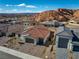 New homes nestled in a scenic desert landscape with red rock formations in the background at 647 Quarry Pass, Mesquite, NV 89034