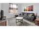 Comfortable living room featuring a gray sofa and modern decor at 647 Quarry Pass, Mesquite, NV 89034