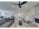 Open concept living area with hardwood floors and a ceiling fan at 6938 Stober Ct, Las Vegas, NV 89147