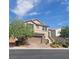 Two-story house with stone accents and landscaping at 7914 Torreys Peak St, Las Vegas, NV 89166