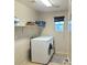 Laundry room with washer, dryer, and shelving at 7914 Torreys Peak St, Las Vegas, NV 89166