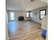 Spacious living room with wood-look floors at 7914 Torreys Peak St, Las Vegas, NV 89166