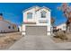 Two-story house with attached garage, and neutral color scheme at 8214 Mt Brodie Cir, Las Vegas, NV 89145