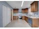 Modern kitchen with wood cabinets and tile floors at 8214 Mt Brodie Cir, Las Vegas, NV 89145