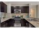 Modern kitchen with stainless steel appliances and granite countertops at 8255 Las Vegas Blvd # 1317, Las Vegas, NV 89123