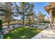 Landscaped backyard oasis with a sparkling pool and golf course views at 8649 Robinson Ridge Dr, Las Vegas, NV 89117