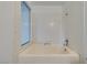 Clean bathroom with shower/tub combo and white tile at 929 Willow Tree Dr # B, Las Vegas, NV 89128