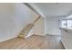 Bright entryway with stairs leading upstairs, wood-look floors and neutral walls at 929 Willow Tree Dr # B, Las Vegas, NV 89128