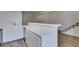 Kitchen features white cabinets and a breakfast bar at 929 Willow Tree Dr # B, Las Vegas, NV 89128