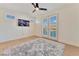 Bright bedroom with balcony access and ceiling fan at 10002 Trapper Mountain St, Las Vegas, NV 89178