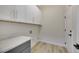 Laundry room with gray cabinets and white countertops at 1343 Panini Dr, Henderson, NV 89052