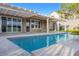 Home exterior featuring a refreshing pool and covered patio at 1343 Panini Dr, Henderson, NV 89052