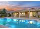 Inviting pool with a pergola-covered patio and beautiful sunset views at 1343 Panini Dr, Henderson, NV 89052