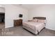 Simple bedroom with a dresser and large bed at 1361 White Water Way, Mesquite, NV 89034