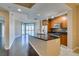 Modern kitchen with island, granite counters, and wood cabinets at 200 W Sahara Ave # 2110, Las Vegas, NV 89102