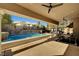 Relaxing pool area with covered patio and outdoor seating at 2111 Bogart Ct, Las Vegas, NV 89117