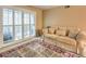 Bright bedroom with a beige sofa, a rug, and patio door access at 2750 S Durango # 1016, Las Vegas, NV 89117