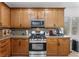 Stainless steel appliances and wood cabinets in this well-lit kitchen at 3709 Citrus Heights Ave, North Las Vegas, NV 89081