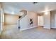 Living room with tile flooring, neutral walls, and access to the kitchen at 5330 E Charleston Blvd # 101, Las Vegas, NV 89142