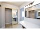 Modern bathroom with gold sliding doors and marble vanity at 5376 Modena Dr, Las Vegas, NV 89120