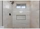 Clean shower with light beige tile and built-in shelf at 5376 Modena Dr, Las Vegas, NV 89120