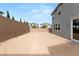 Large backyard with gravel and block wall at 5921 Bruselas St, Las Vegas, NV 89113