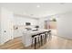 Modern kitchen with white cabinets, center island, and stainless steel appliances at 5921 Bruselas St, Las Vegas, NV 89113