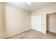 Well-lit bedroom with double door closet and carpet at 5950 Barbosa Dr # 8, North Las Vegas, NV 89031