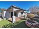 View of backyard with covered patio and fire pit at 6257 Dayton Ave, Las Vegas, NV 89107