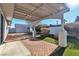 Covered patio, fire pit, and storage shed in backyard at 6257 Dayton Ave, Las Vegas, NV 89107