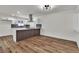 Bright dining area with wood-look floors and kitchen view at 6257 Dayton Ave, Las Vegas, NV 89107