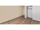 Spacious bedroom with wood-look floors and closet at 7258 Summer Grove Ave, Las Vegas, NV 89117