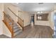 Bright entryway with wood staircase and vinyl flooring at 7258 Summer Grove Ave, Las Vegas, NV 89117