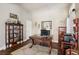 Bright home office with built-in wooden cabinets and a large desk at 7521 Apple Springs Ave, Las Vegas, NV 89131