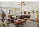 Open concept living room with a view of the kitchen and hardwood floors throughout at 7521 Apple Springs Ave, Las Vegas, NV 89131