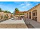 Large backyard with pergola, patio, and landscaping at 7954 Blue Venice Ct, Las Vegas, NV 89117