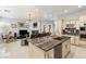 Spacious kitchen featuring granite countertops, stainless steel appliances, and custom cabinetry at 7954 Blue Venice Ct, Las Vegas, NV 89117