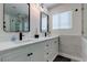 Modern bathroom with double vanity, frameless shower, and marble tile at 8901 Dio Guardi Dr, Las Vegas, NV 89117