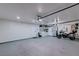 Spacious garage with storage and motorcycle at 8901 Dio Guardi Dr, Las Vegas, NV 89117