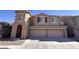 Two-story house with three-car garage and desert landscaping at 9668 Padre Peak Ct, Las Vegas, NV 89178