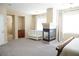 Main bedroom with fireplace, large windows, and ceiling fan at 9668 Padre Peak Ct, Las Vegas, NV 89178