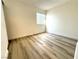 Bright and airy bedroom with laminate wood flooring at 119 E Van Wagenen St, Henderson, NV 89015