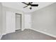 Bright bedroom featuring a mirrored closet and neutral carpeting at 1725 Rugged Ravine Ct, Las Vegas, NV 89183