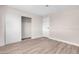 Spacious bedroom with wood-look floors, large closet, and neutral wall colors at 1747 Jupiter Ct # D, Las Vegas, NV 89119